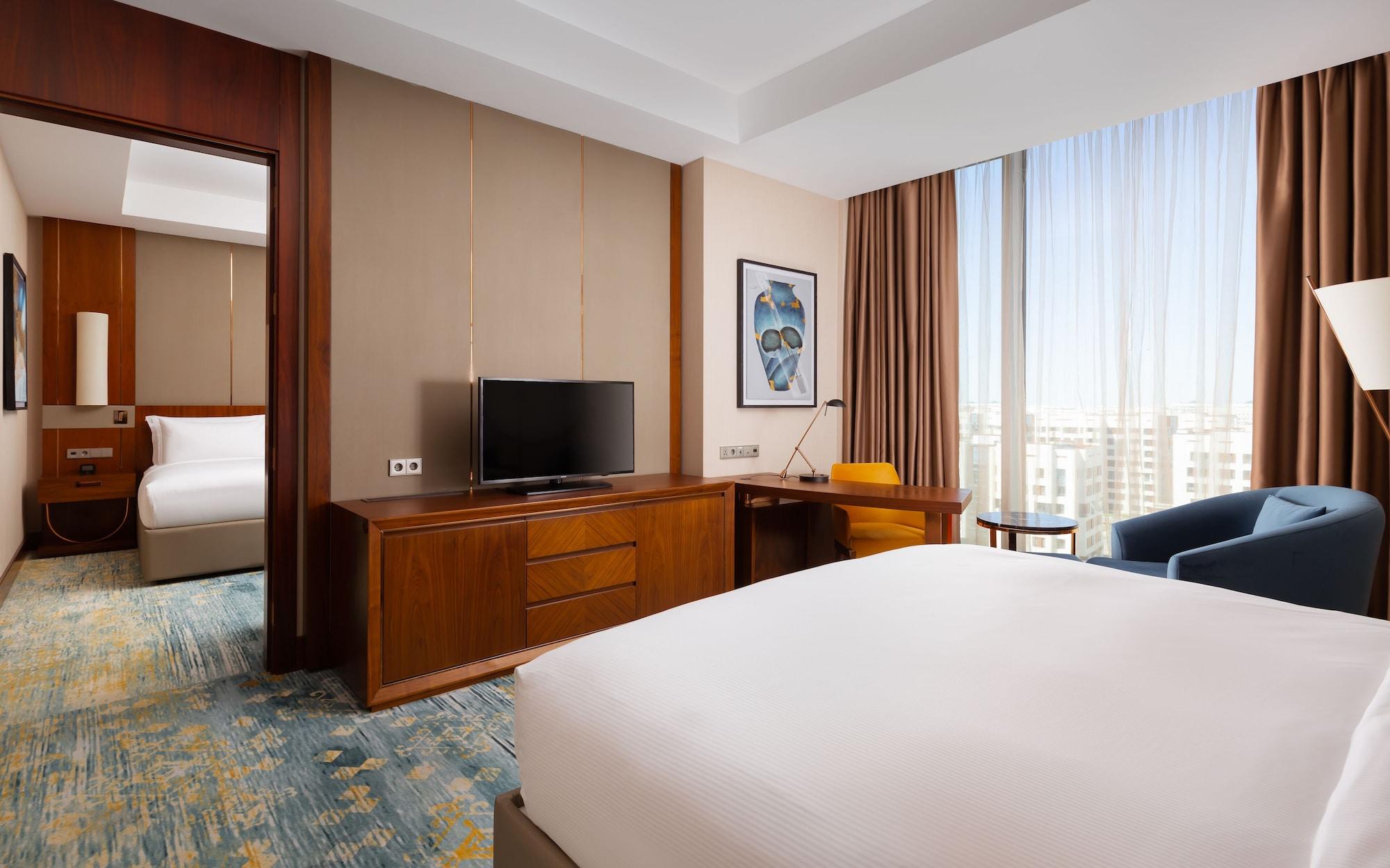 Hotel Hilton Astana Zewnętrze zdjęcie A guest room at the hotel
